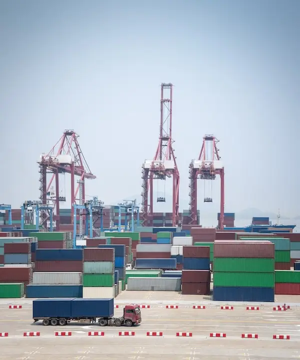 Large container terminal with red cranes at Port of Ningbo-Zhoushan China
