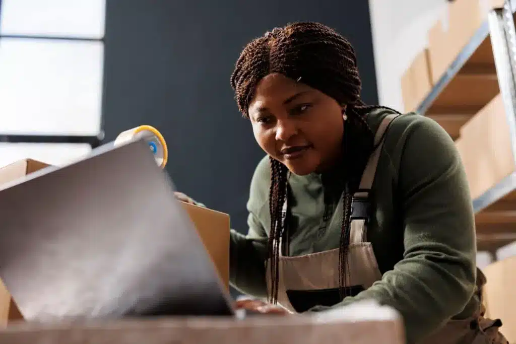 Employee checking a customer order in a warehouse