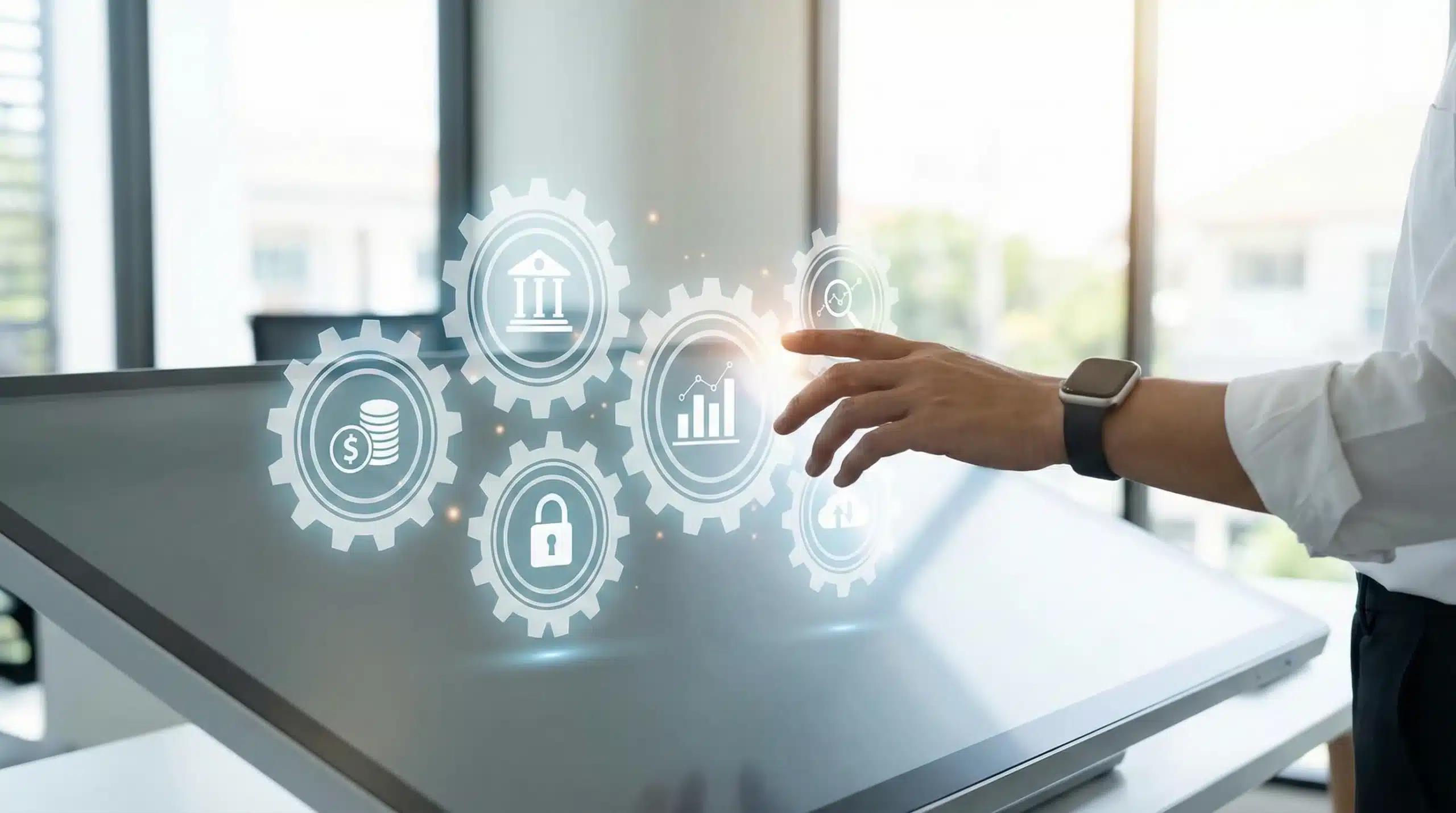 Hand reaching toward digital gears displaying asset management icons and business analytics