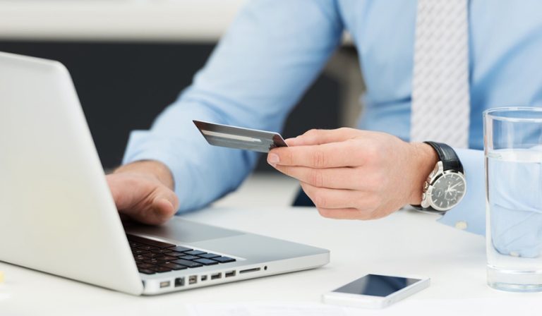 man making online credit card transaction