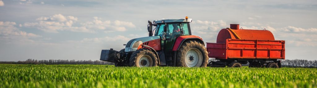 farm management showing tractor in field