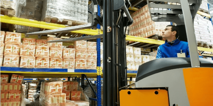removing stock from a shelf with a forklift