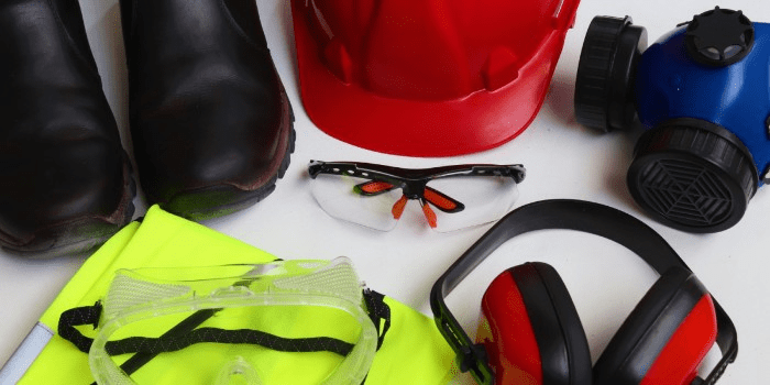 PPE: boots, hard hat, safety glasses, vest, respirator, and ear protection