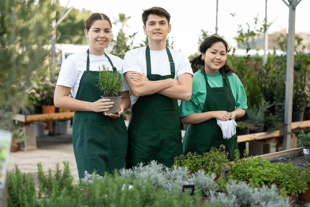 greenhouse workers smiling