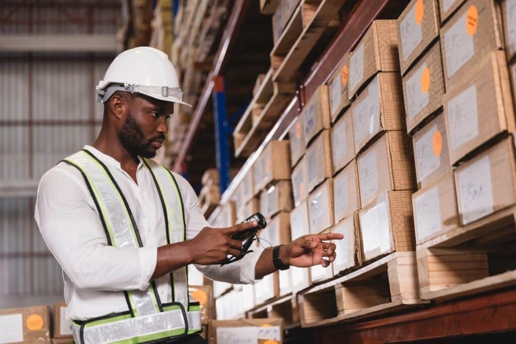 warehouse worker scanning a barcode on a box