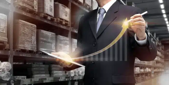 Businessman-using-tablet-to-measure-warehouse-profitability