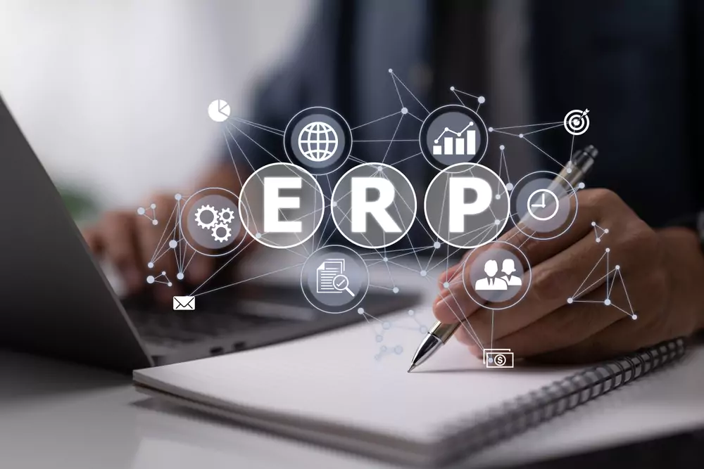 a person writing with floating icons above showing integrations with ERP written above