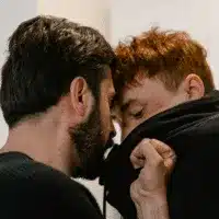 Two men engaged in physical altercation demonstrating workplace security threat